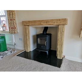 Morso Badger 5kw multifuel stove. Focus cast beamish which is a non combustible wood effect surround. Black polished granite hearth. 